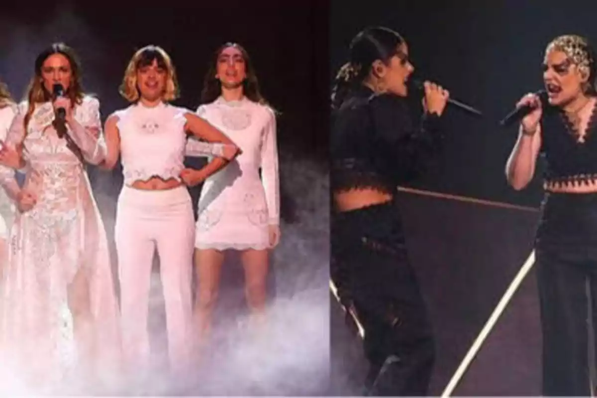 Grupo de mujeres cantando en el escenario, algunas vestidas de blanco y otras de negro.