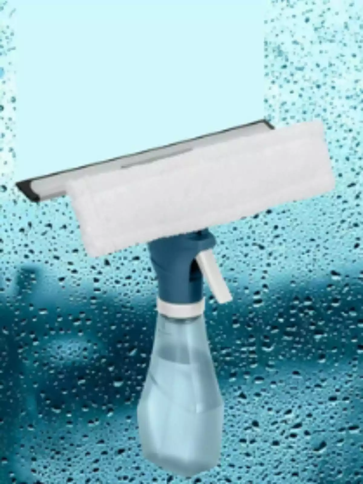 Limpiador de vidrios de Lidl con rociador y esponja frente a una ventana con gotas de agua. Limpiador de vidrios de Lidl con rociador y esponja frente a una ventana con gotas de agua.