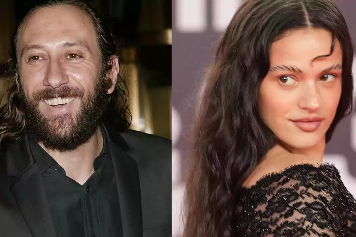 Un hombre con barba y cabello largo sonríe mientras viste un traje oscuro junto a una mujer de cabello largo y suelto que mira hacia atrás con un vestido negro de encaje
