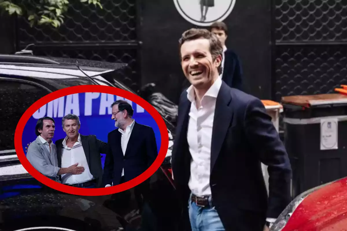 Un hombre sonriente con chaqueta oscura y camisa blanca está de pie junto a un coche, mientras en la esquina inferior izquierda aparece un recuadro rojo con tres hombres en un escenario conversando entre ellos