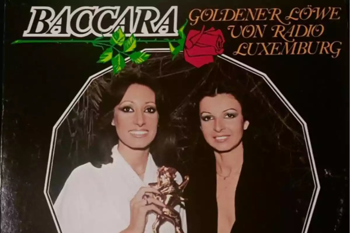 Portada de un disco de Baccara con dos mujeres posando sonrientes, una de ellas sostiene un trofeo dorado en forma de león, sobre un fondo negro con una rosa roja y letras doradas Portada de un disco de Baccara con dos mujeres posando sonrientes, una de ellas sostiene un trofeo dorado en forma de león, sobre un fondo negro con una rosa roja y letras doradas