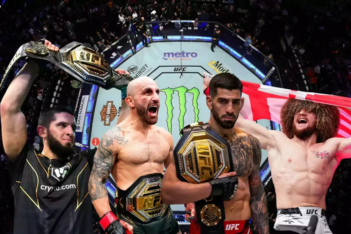 Cuatro peleadores de artes marciales mixtas con cinturones de campeón de UFC posan frente a un octágono lleno de público