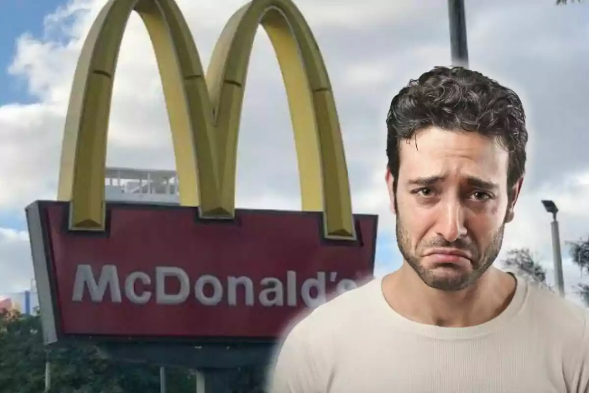 Hombre con expresión triste frente a un letrero de McDonald's