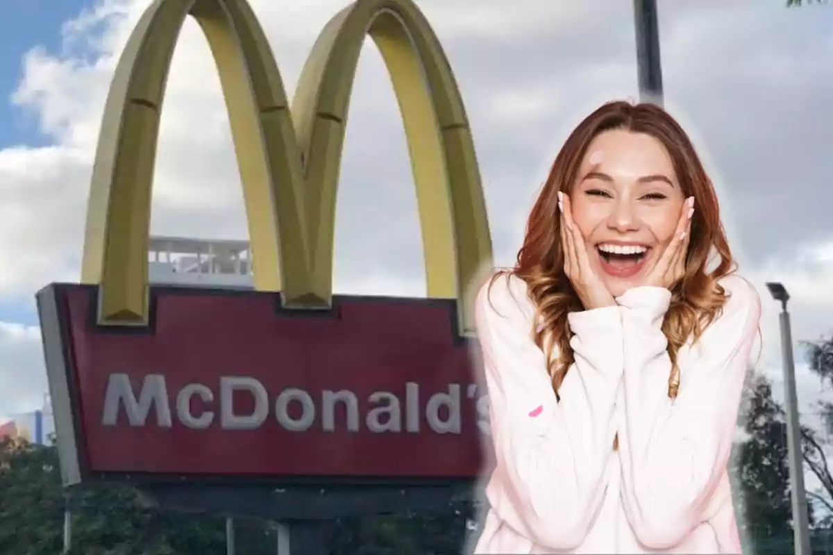 Una mujer sonriente con las manos en el rostro está frente a un letrero de McDonald's