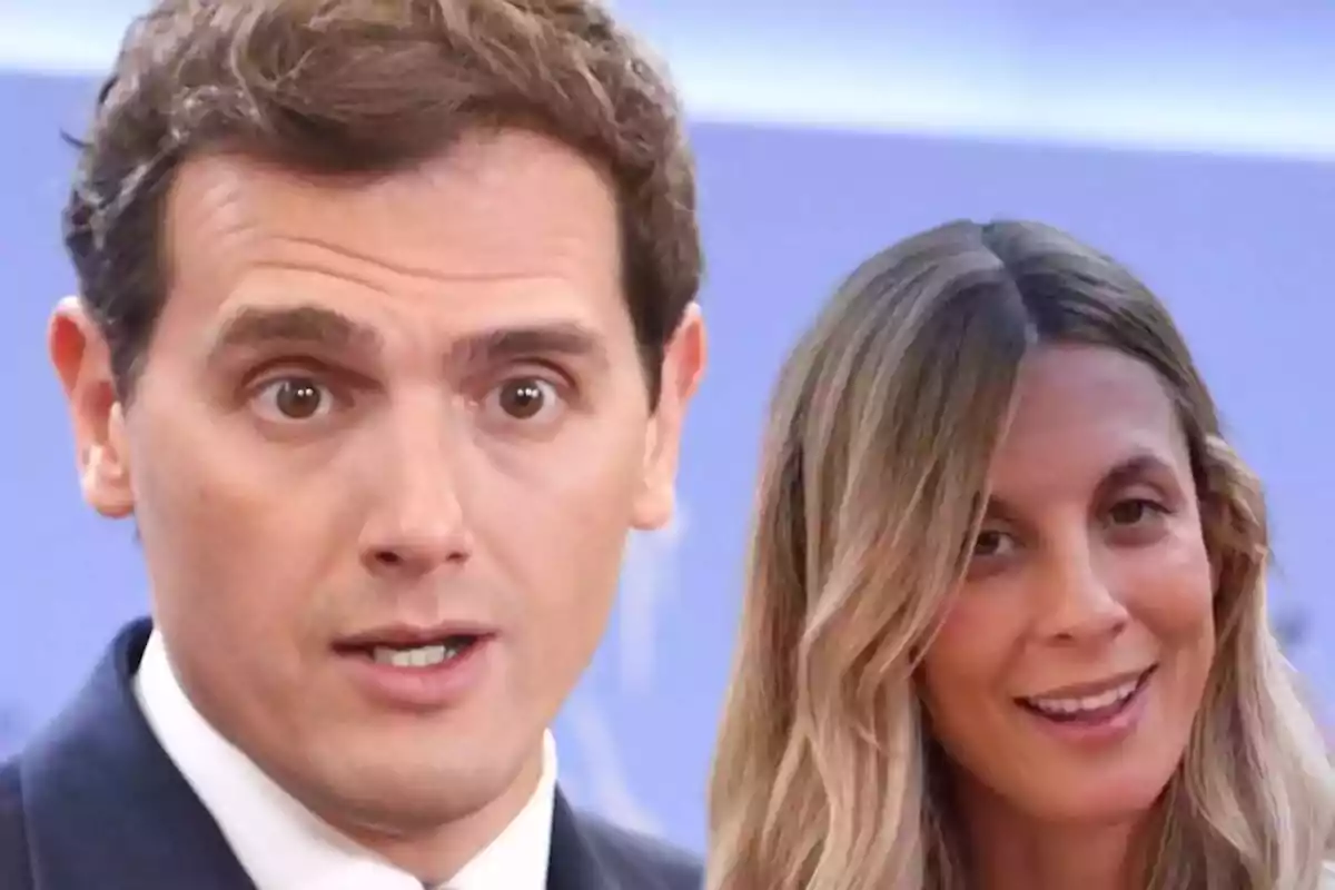 Un hombre con expresión de sorpresa y una mujer sonriendo aparecen juntos frente a un fondo azul desenfocado. Un hombre con expresión de sorpresa y una mujer sonriendo aparecen juntos frente a un fondo azul desenfocado.