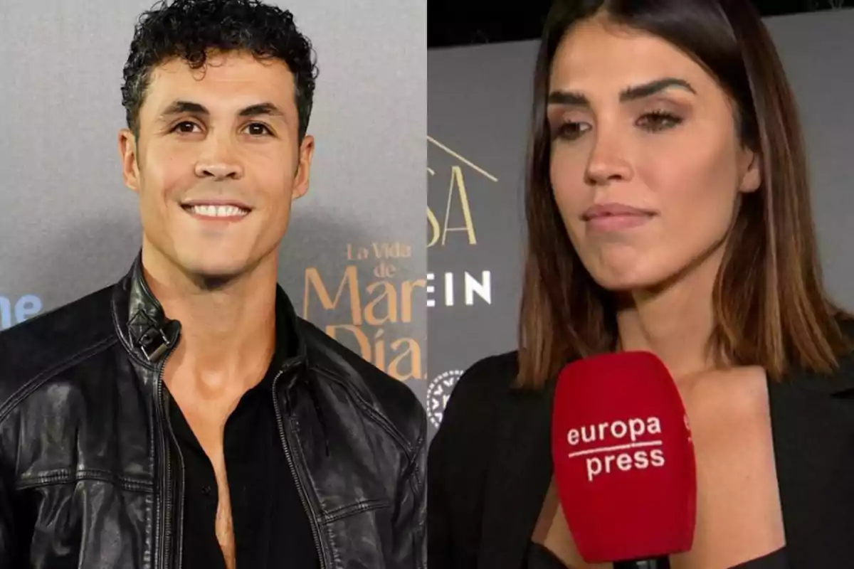 Un hombre con chaqueta de cuero negra sonríe frente a un fondo gris mientras una mujer de cabello liso sostiene un micrófono rojo de europa press en un evento