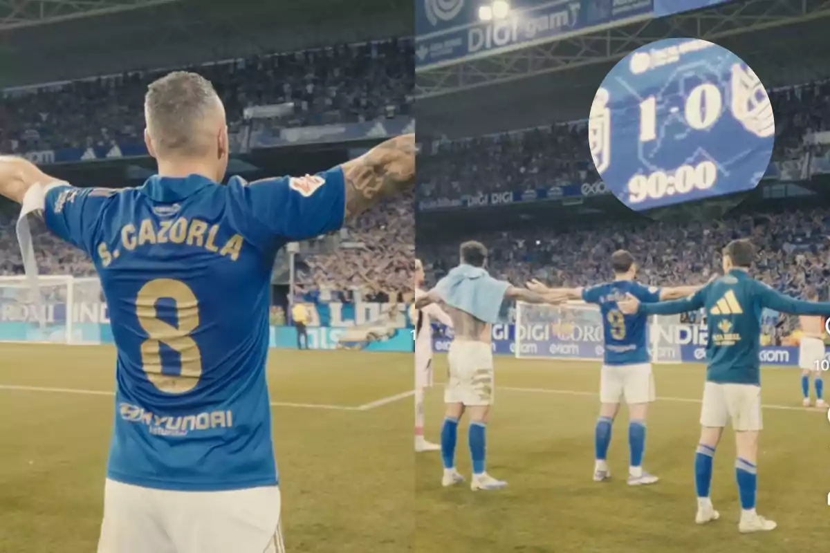 Jugadores del Real Oviedo celebran en el campo frente a su afición tras ganar un partido uno a cero, con el marcador final mostrando 90 minutos