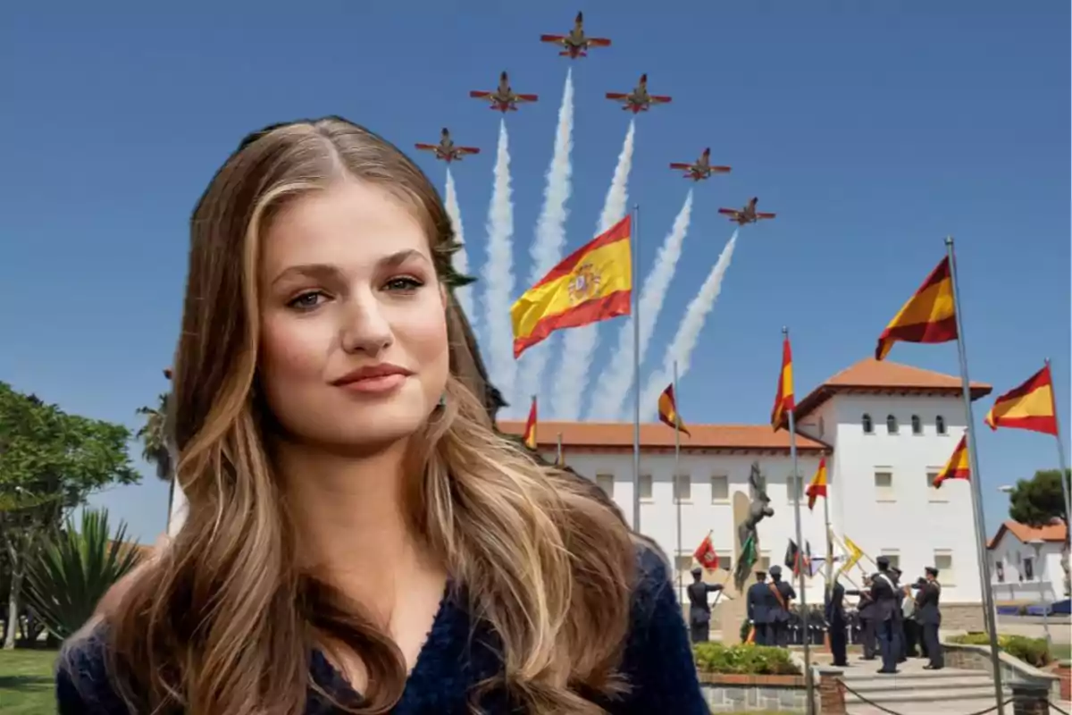A young woman with long blonde hair appears in the foreground with a white building in the background, several Spanish flags waving, and airplanes performing an air show in the clear sky.