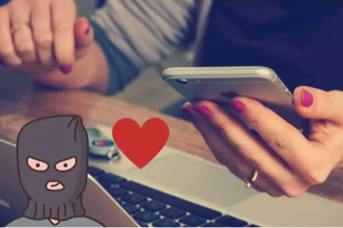Persona usando un teléfono móvil con una ilustración de un ladrón y un corazón rojo.