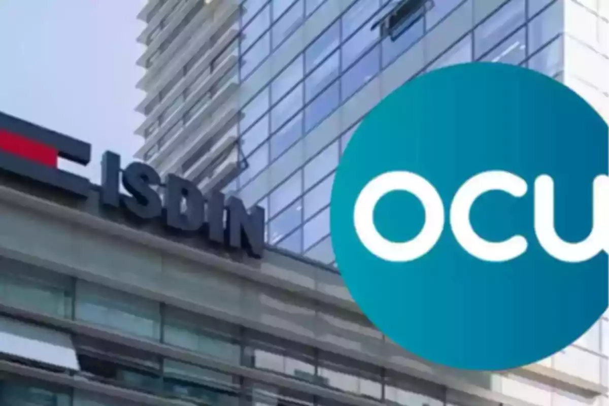 Edificio moderno con logotipos de ISDIN y OCU en la fachada. Edificio moderno con logotipos de ISDIN y OCU en la fachada.