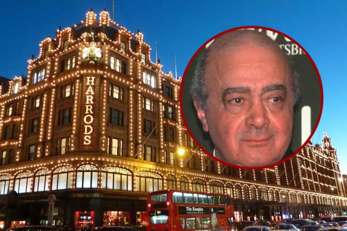 Fachada iluminada de la tienda Harrods en Londres con un autobús rojo y un retrato de un hombre en un círculo superpuesto.