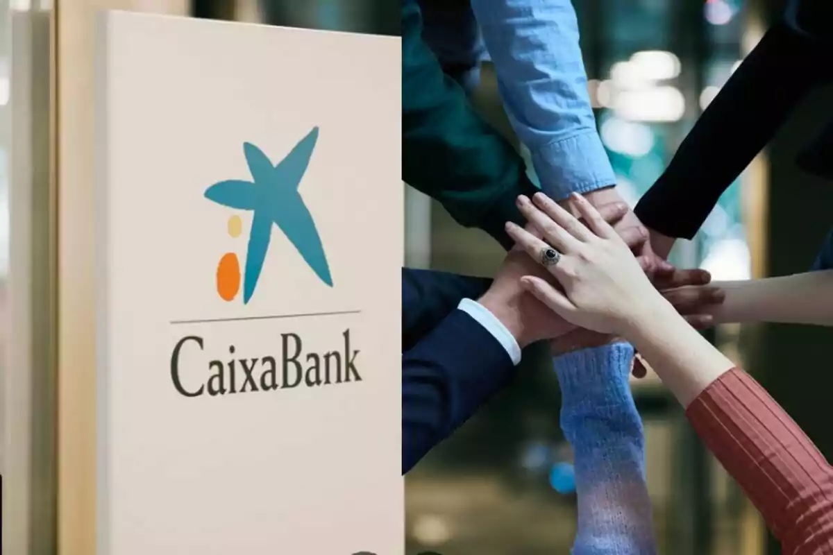 Un cartel de CaixaBank junto a un grupo de personas uniendo sus manos en señal de colaboración.