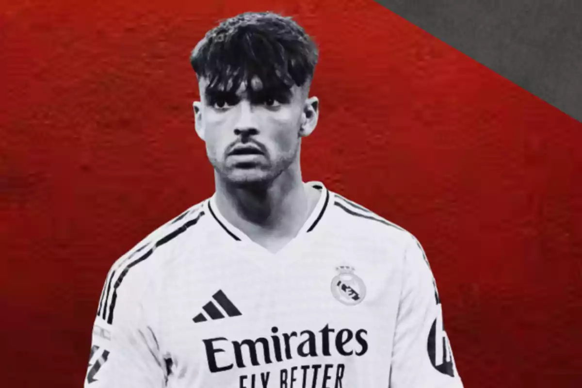 Un jugador de fútbol con camiseta blanca del Real Madrid sobre un fondo rojo y negro.