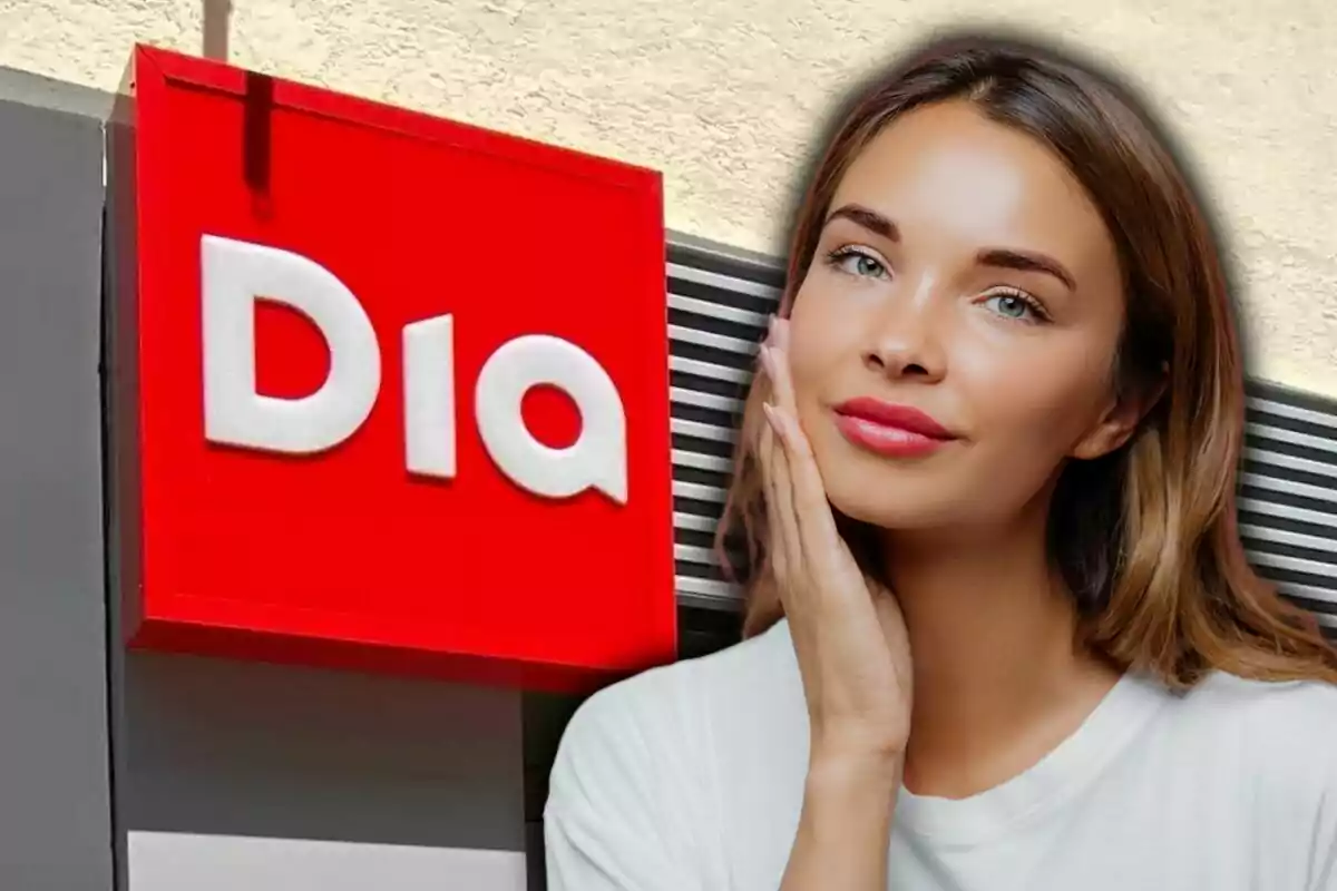 Una mujer joven con cabello castaño claro posa tocando su rostro frente a un cartel rojo de la tienda Dia