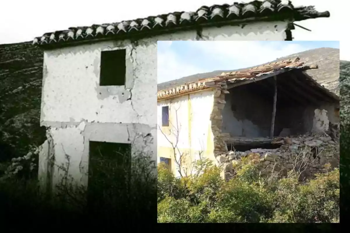 Una casa antigua y deteriorada con paredes agrietadas y un techo parcialmente colapsado, rodeada de vegetación.