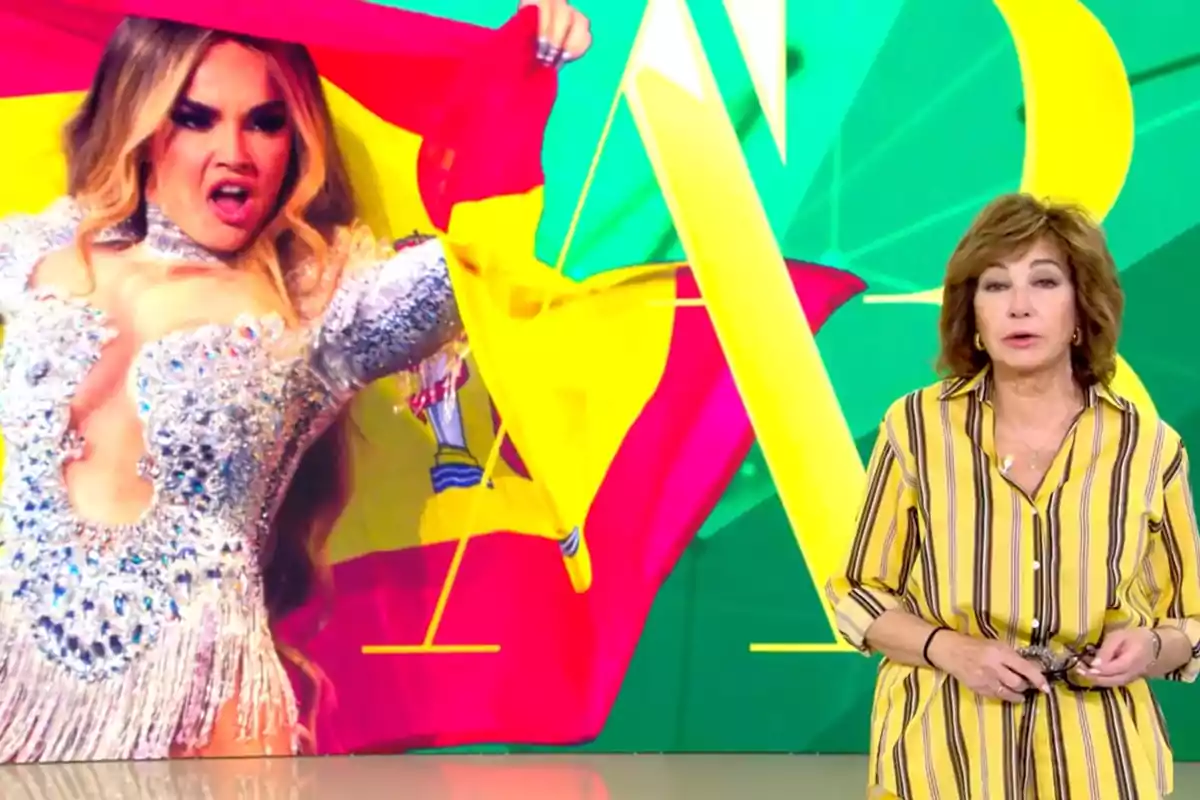 Ana Rosa Quintana está de pie frente a una pantalla que muestra a Melody con un vestido brillante y una bandera de España. Captura de 'El Programa de AR' Ana Rosa Quintana está de pie frente a una pantalla que muestra a Melody con un vestido brillante y una bandera de España. Captura de 'El Programa de AR'