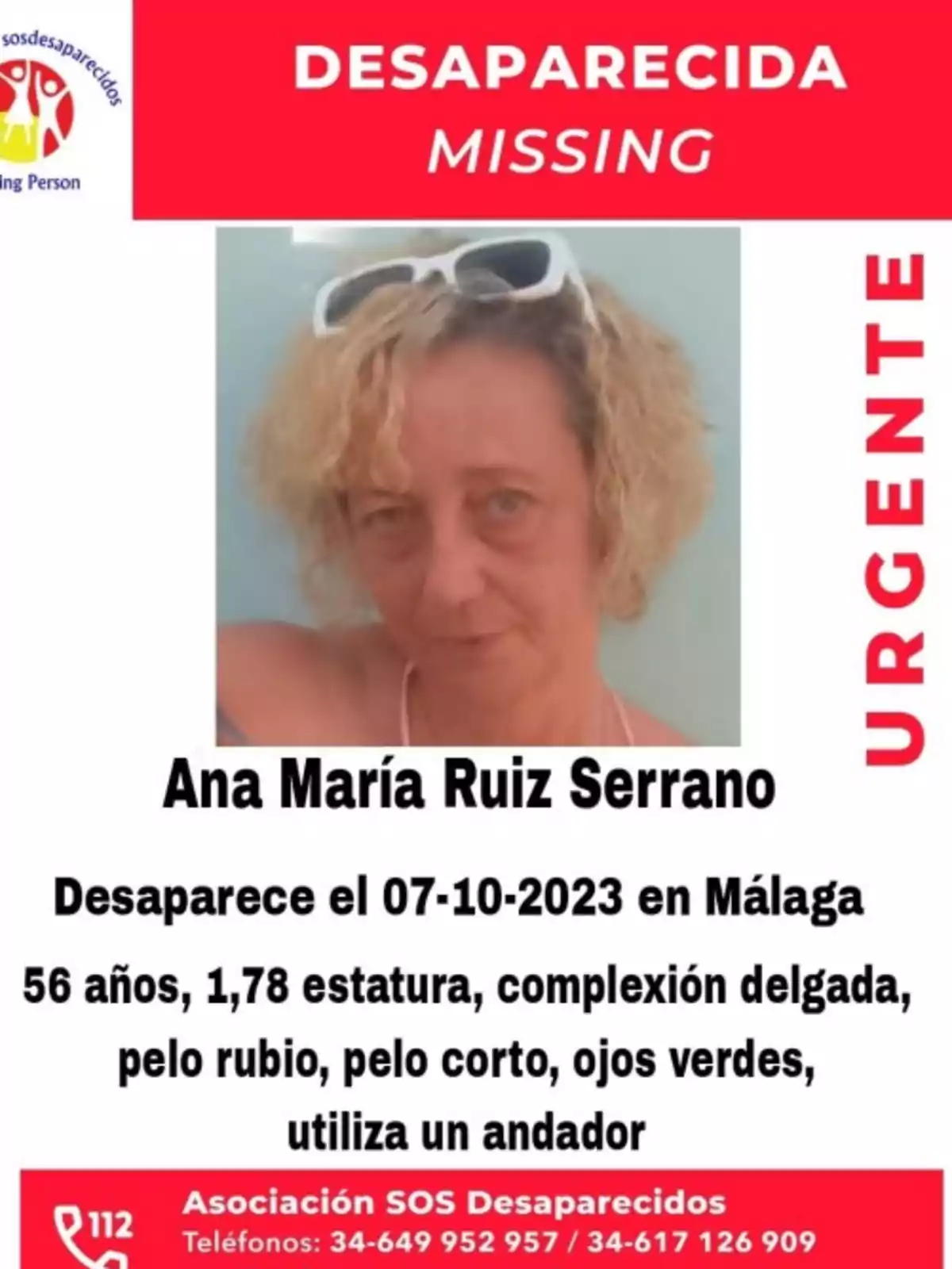 Cartel de persona desaparecida con la foto de una mujer de cabello rubio y corto, con gafas de sol blancas en la cabeza, identificada como Ana María Ruiz Serrano, desaparecida el 07-10-2023 en Málaga, de 56 años, 1,78 de estatura, complexión delgada, pelo rubio, ojos verdes, utiliza un andador, con información de contacto de la Asociación SOS Desaparecidos.