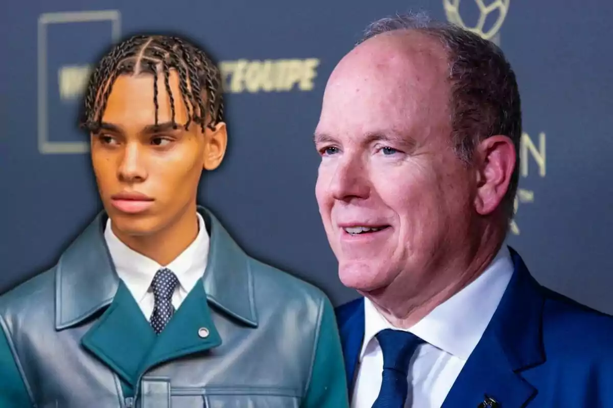 Two men pose together at a formal event, one wearing a blue coat and the other a dark suit. Two men pose together at a formal event, one wearing a blue coat and the other a dark suit.