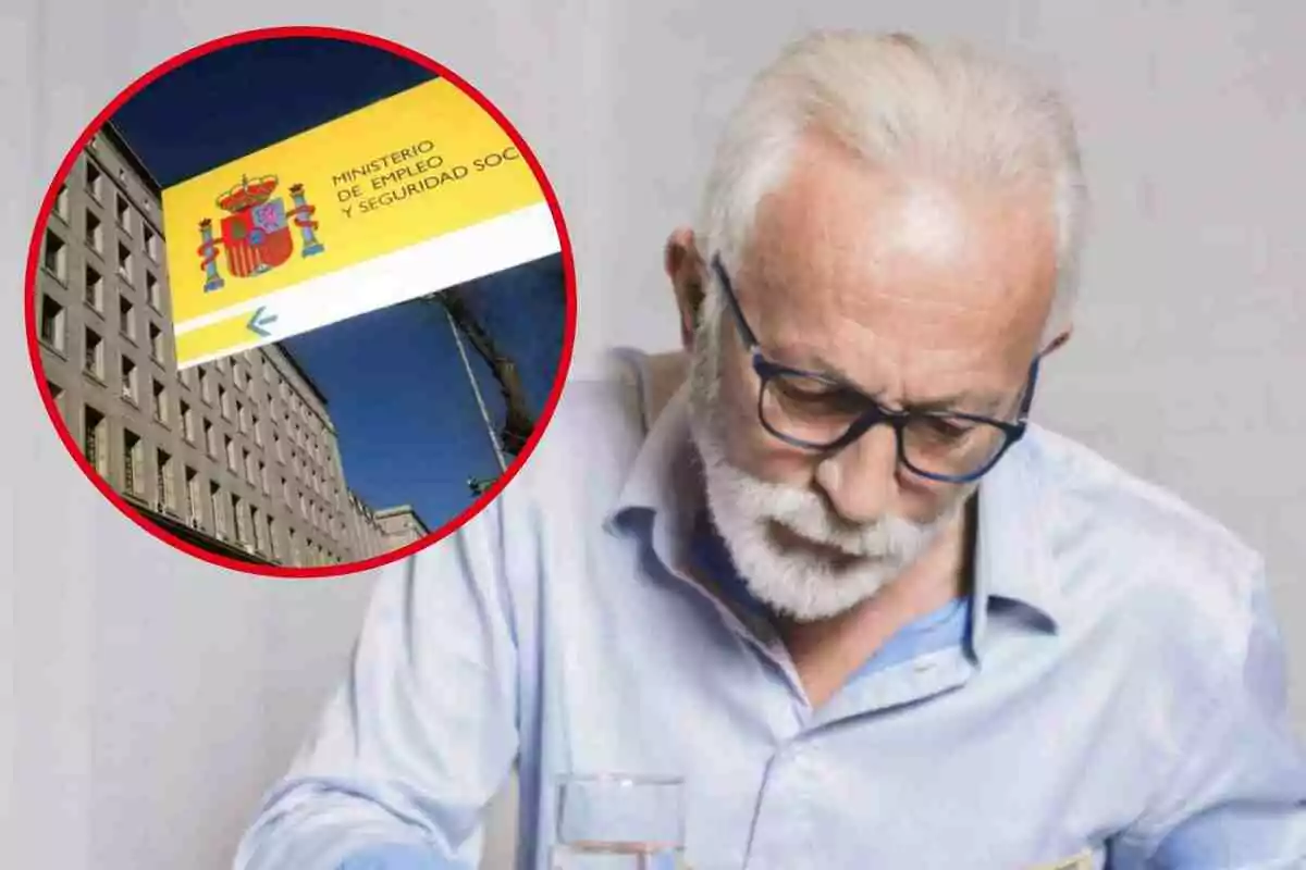 Un hombre mayor con gafas y barba blanca, vestido con una camisa clara, está mirando hacia abajo mientras sostiene un vaso de agua; en la esquina superior izquierda de la imagen hay un recuadro con una foto del edificio del Ministerio de Empleo y Seguridad Social de España.