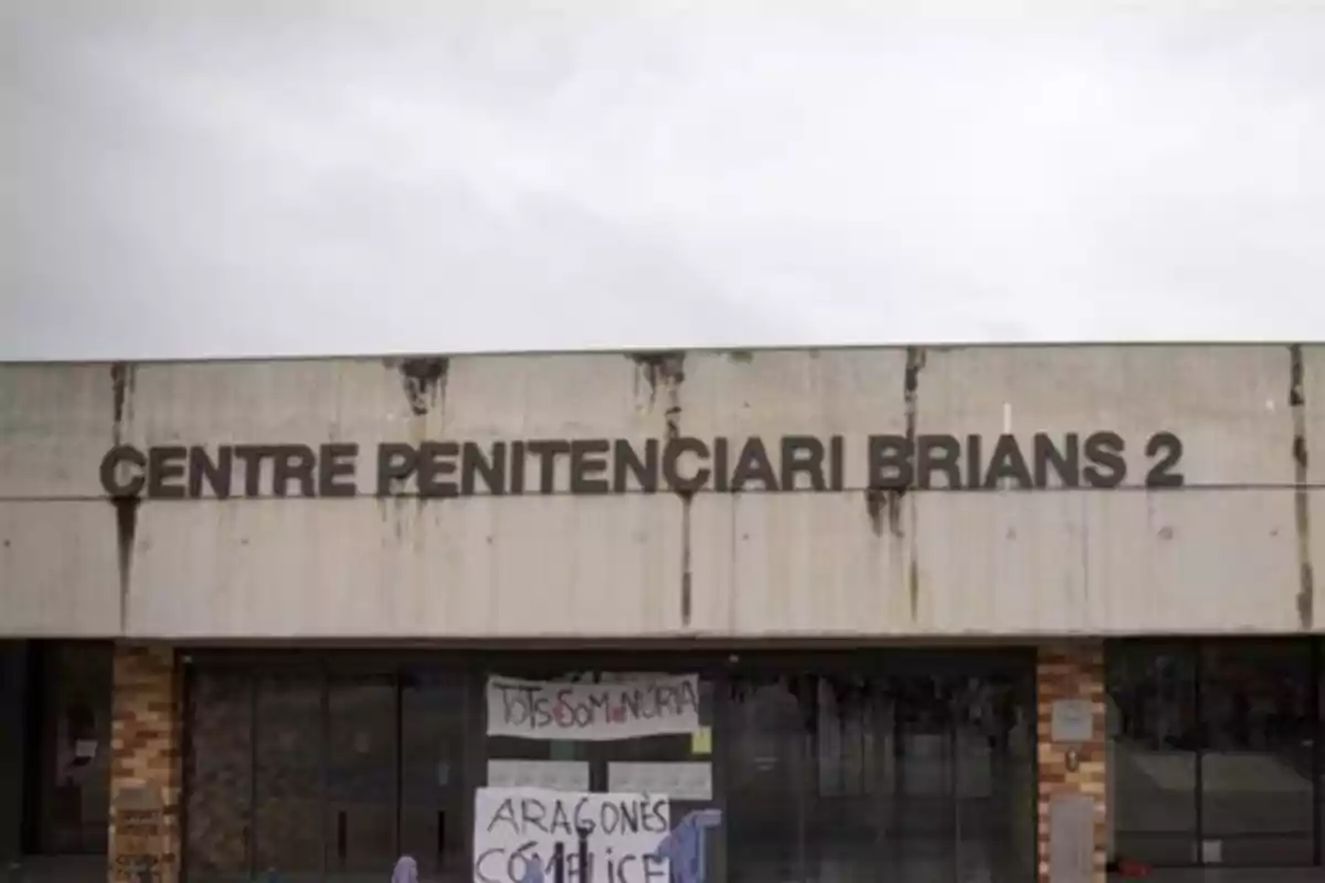 Facade of the Brians 2 Penitentiary Center with protest signs at the entrance Facade of the Brians 2 Penitentiary Center with protest signs at the entrance