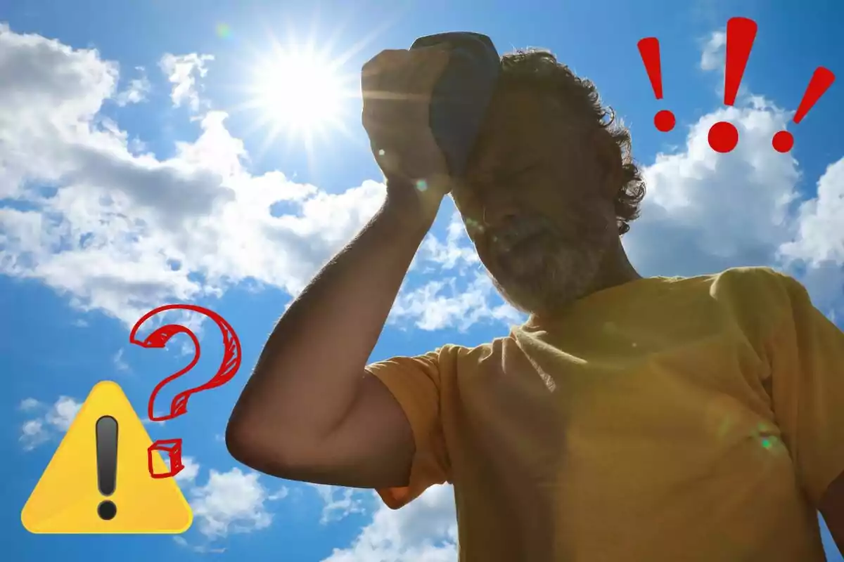 Hombre con camiseta amarilla se cubre la cabeza con un paño bajo el sol brillante, con símbolos de advertencia y exclamación en el cielo.