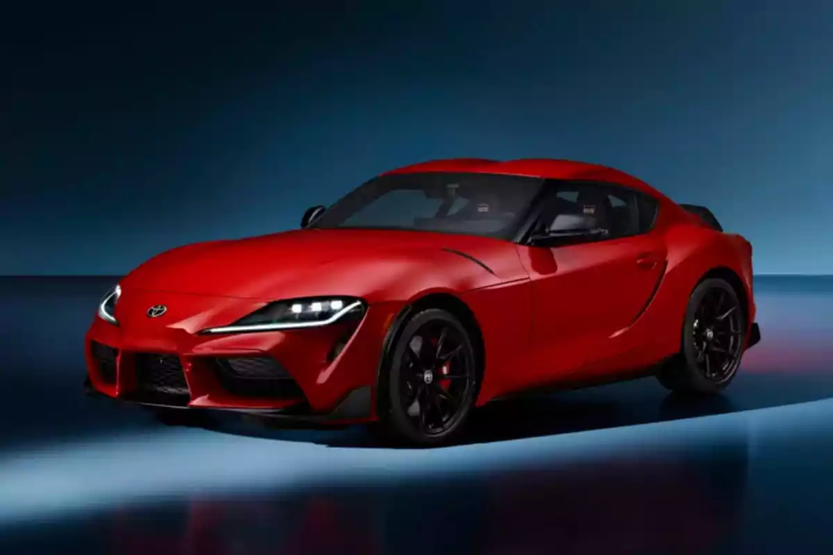 Coche deportivo rojo en un fondo oscuro. Coche deportivo rojo en un fondo oscuro.