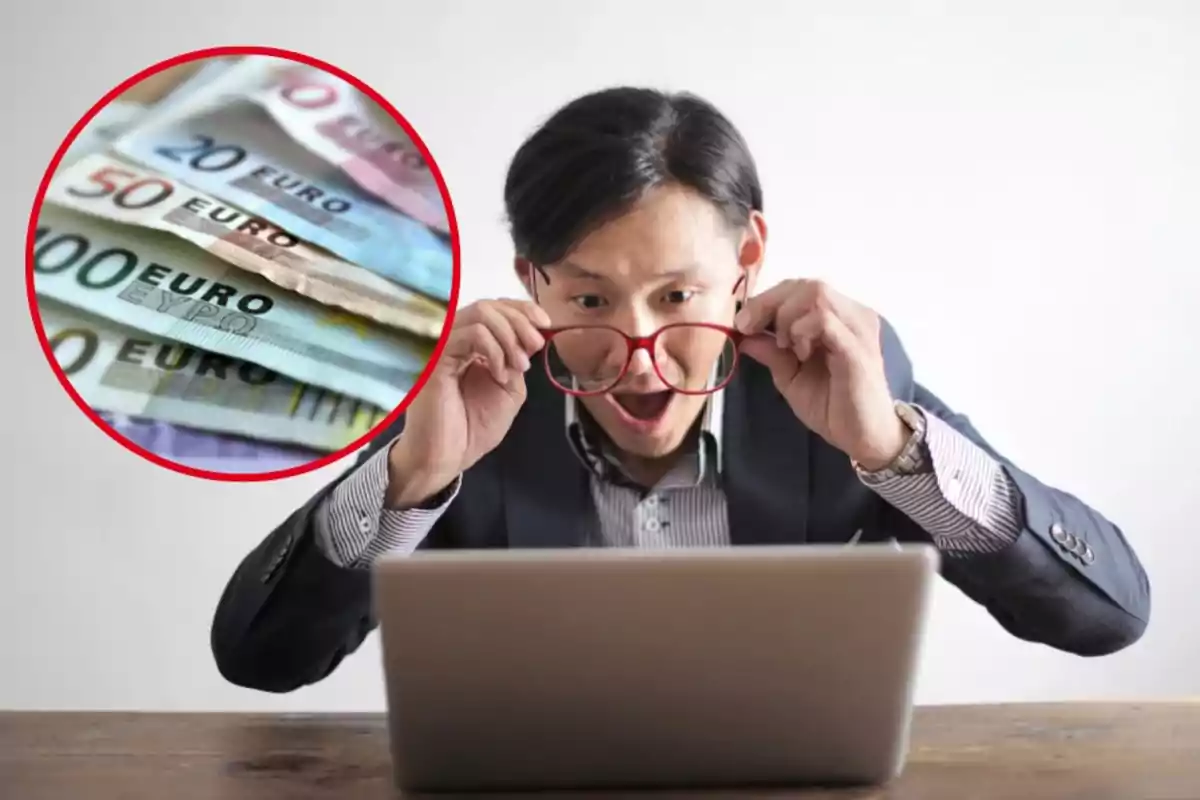 Hombre sorprendido mirando una computadora portátil con una imagen de billetes de euro en un círculo rojo.