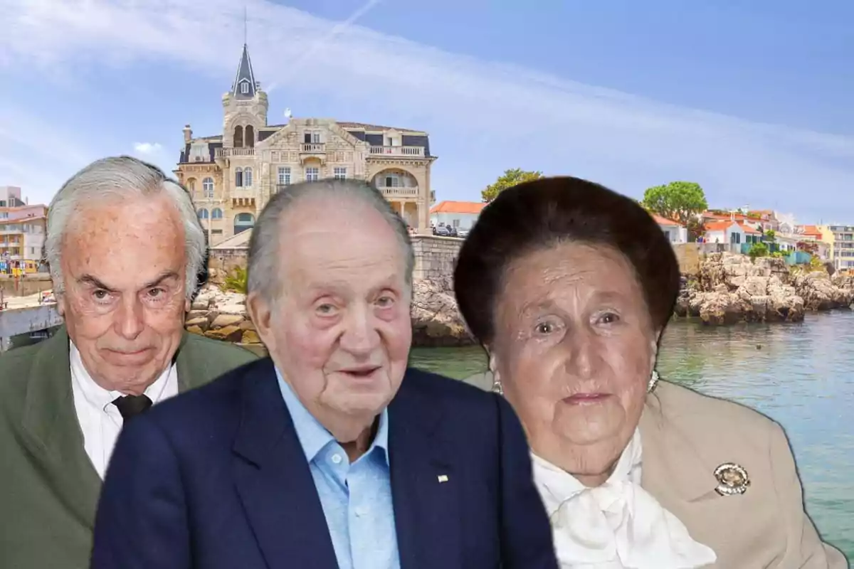 Tres personas mayores posan frente a un edificio histórico junto al mar en un día soleado