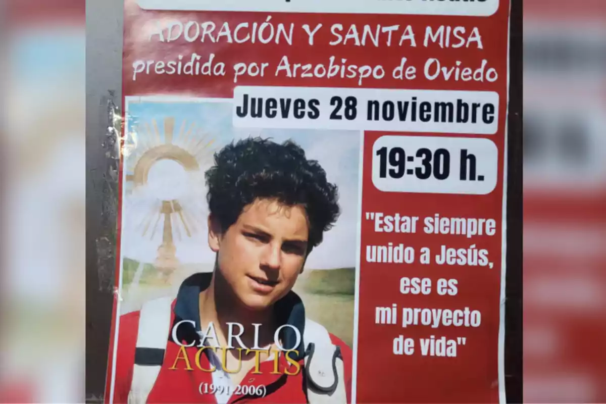 Cartel anunciando una adoración y misa presidida por el Arzobispo de Oviedo el jueves 28 de noviembre a las 19:30 h con una imagen de Carlo Acutis y la frase 