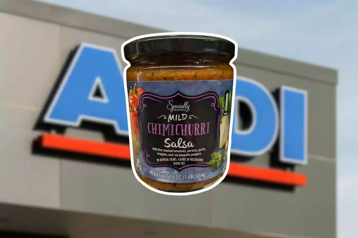 A jar of Specially Selected chimichurri sauce in front of an Aldi store sign. A jar of Specially Selected chimichurri sauce in front of an Aldi store sign.