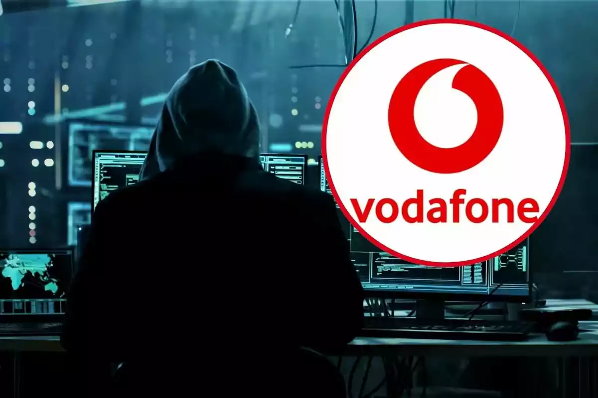 Una persona con capucha frente a múltiples pantallas de computadora en un entorno oscuro con el logotipo de Vodafone superpuesto.