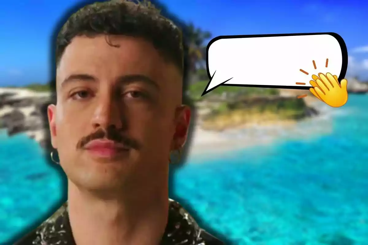 Joshua Velázquez con bigote y arete está frente a un fondo de playa con agua turquesa, hay un globo de diálogo vacío con un emoji de aplauso.