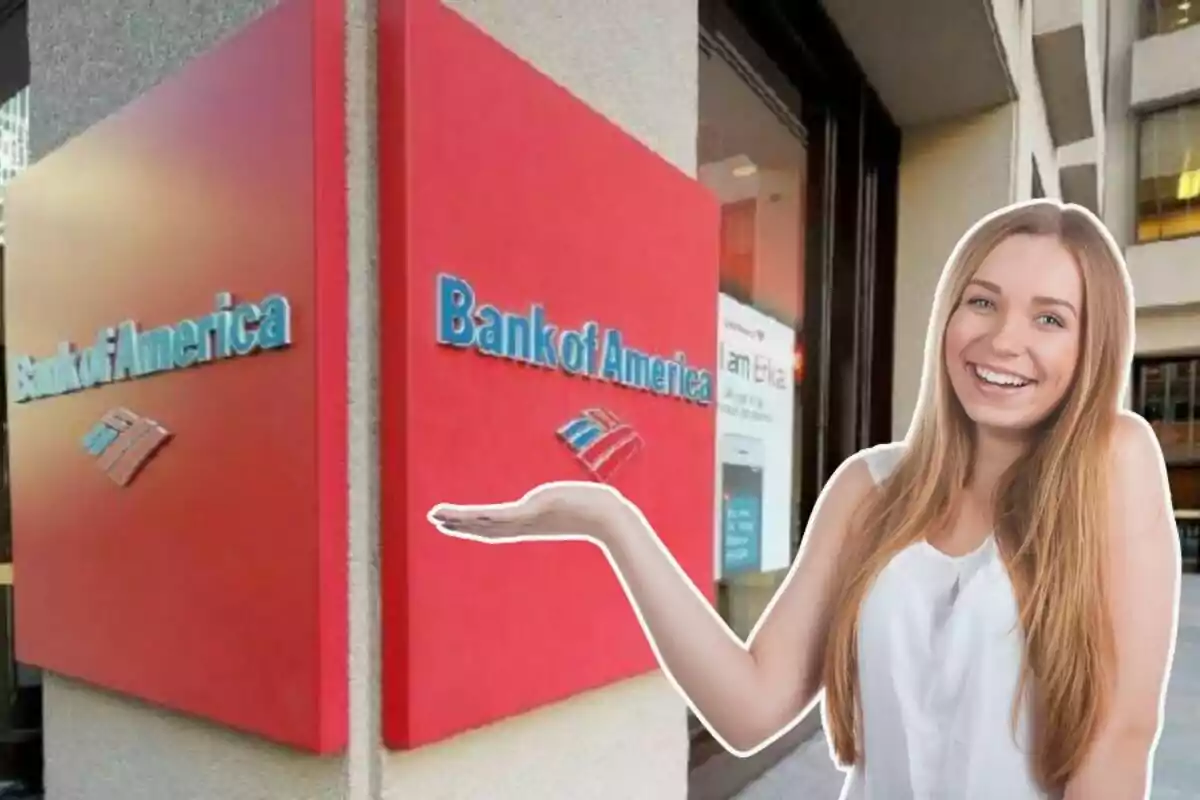A smiling woman with her arm extended in front of a Bank of America sign.