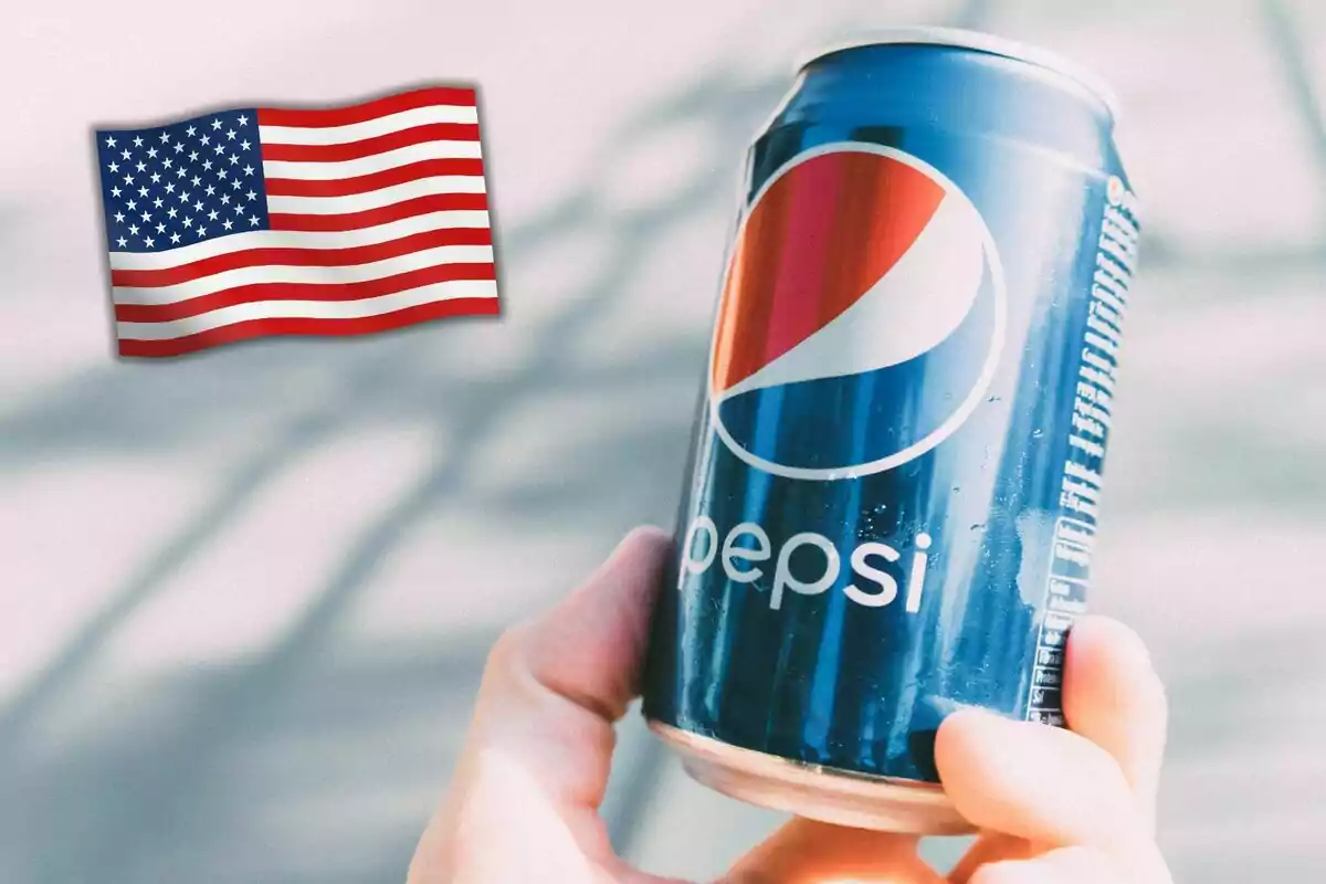 Person holding a can of Pepsi with an American flag in the background Person holding a can of Pepsi with an American flag in the background