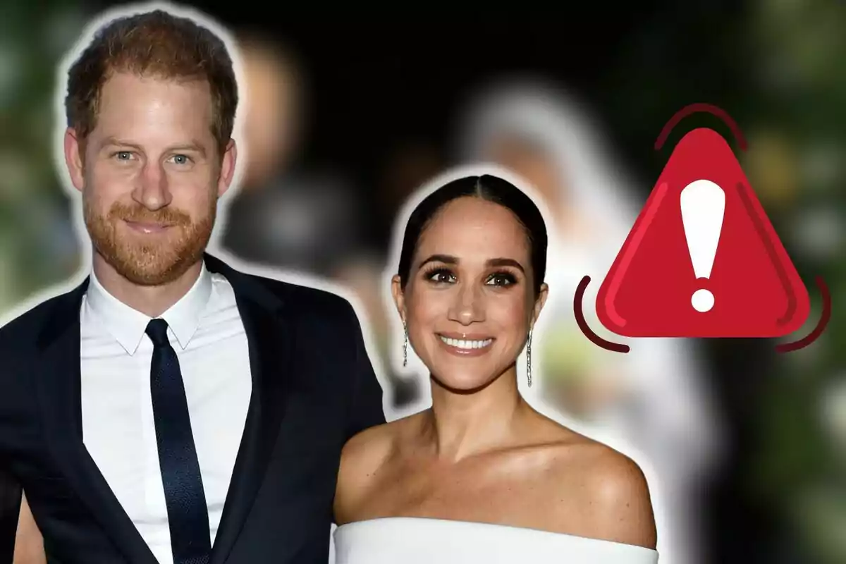 Prince Harry and Meghan Markle smiling posing together with a red warning symbol next to them.