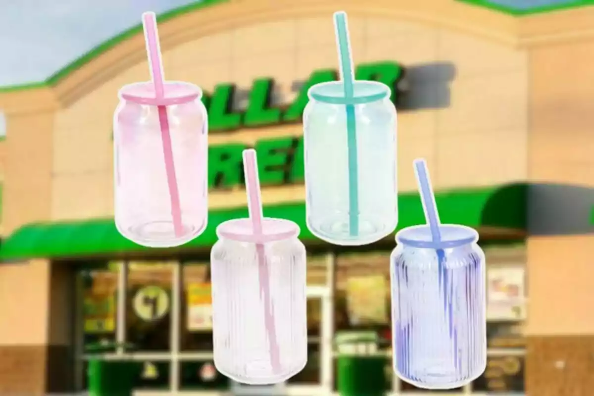 Four plastic cups with straws in pastel colors in front of a store