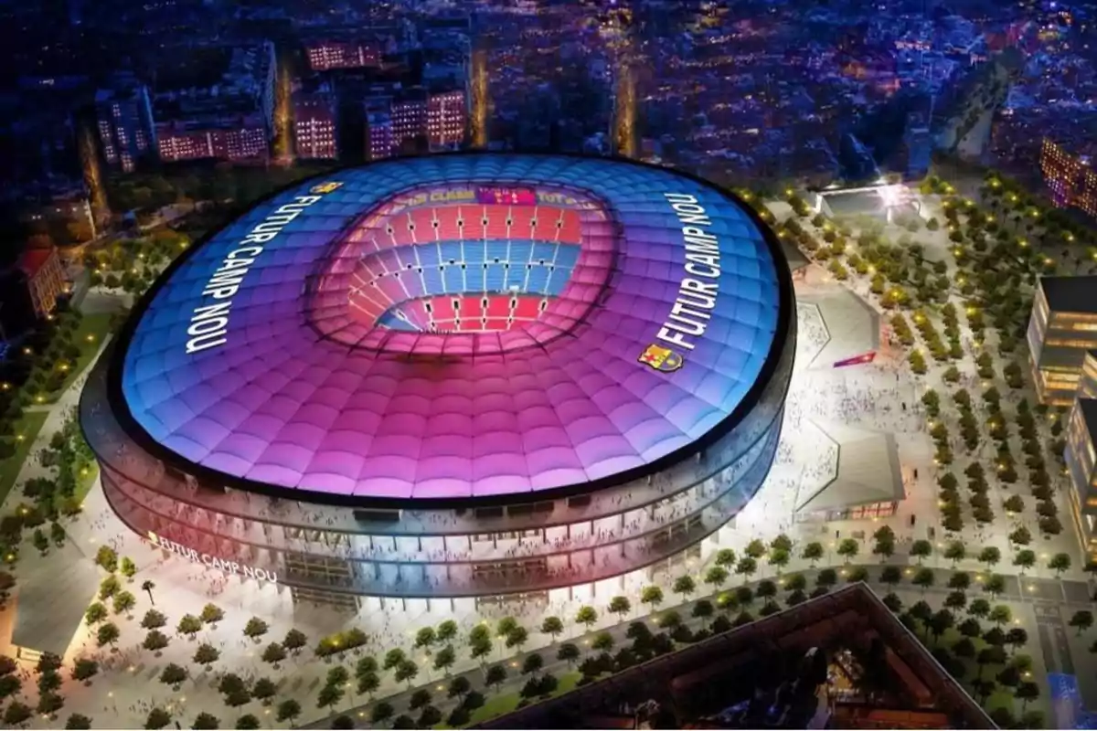 Imagen aérea nocturna del estadio Camp Nou con un diseño futurista iluminado en tonos morados y azules, con la inscripción 