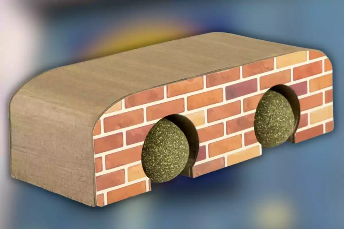 Un objeto de madera con diseño de ladrillos y dos esferas verdes encajadas en su interior. Un objeto de madera con diseño de ladrillos y dos esferas verdes encajadas en su interior.