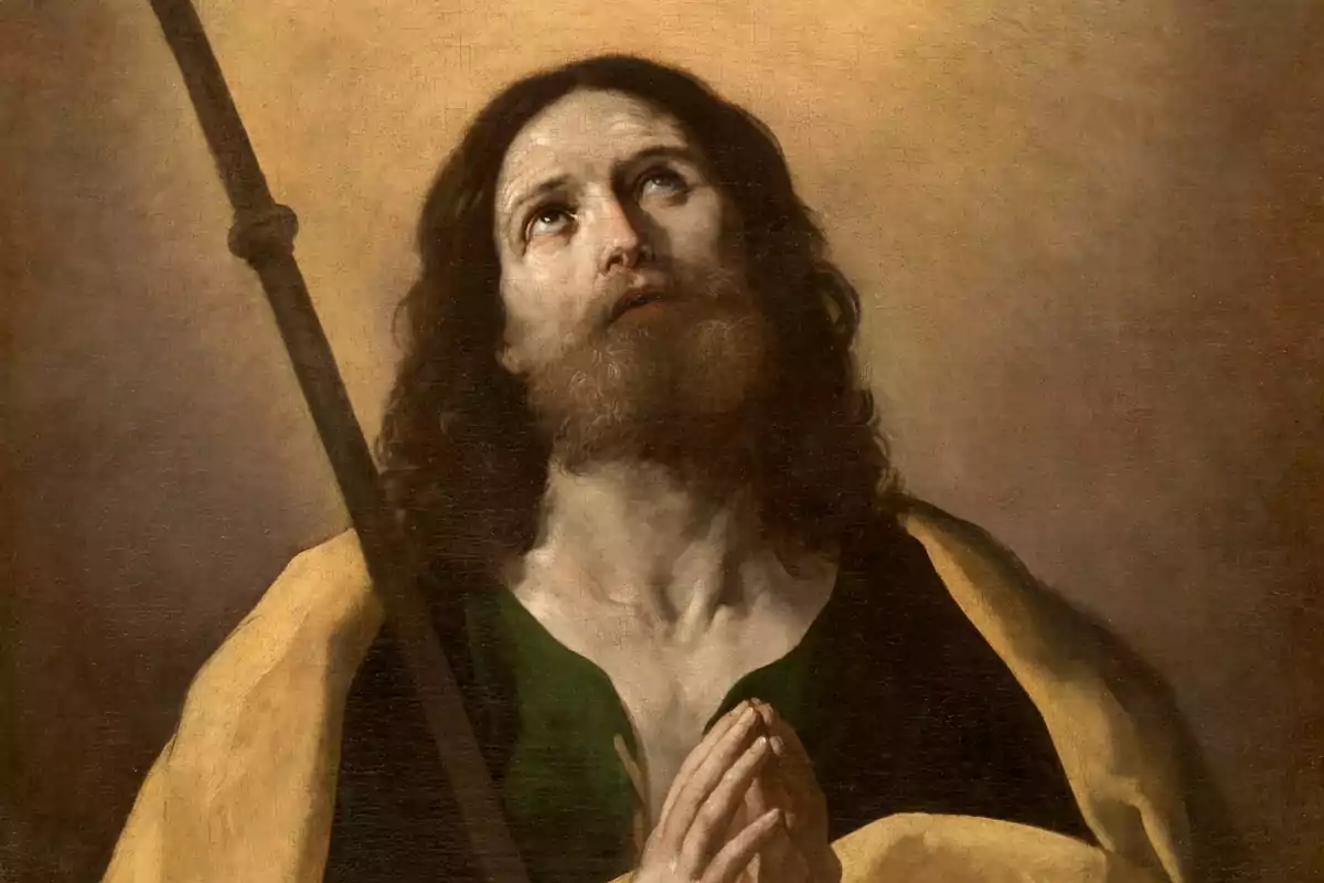 Pintura de un hombre con barba y cabello largo mirando hacia arriba con las manos juntas en actitud de oración, con un fondo de tonos cálidos y una vara en su hombro.