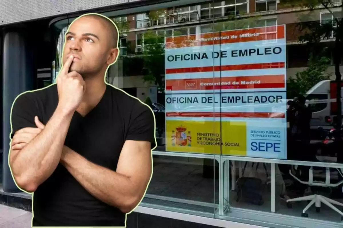 Un hombre pensativo frente a una oficina de empleo en Madrid.
