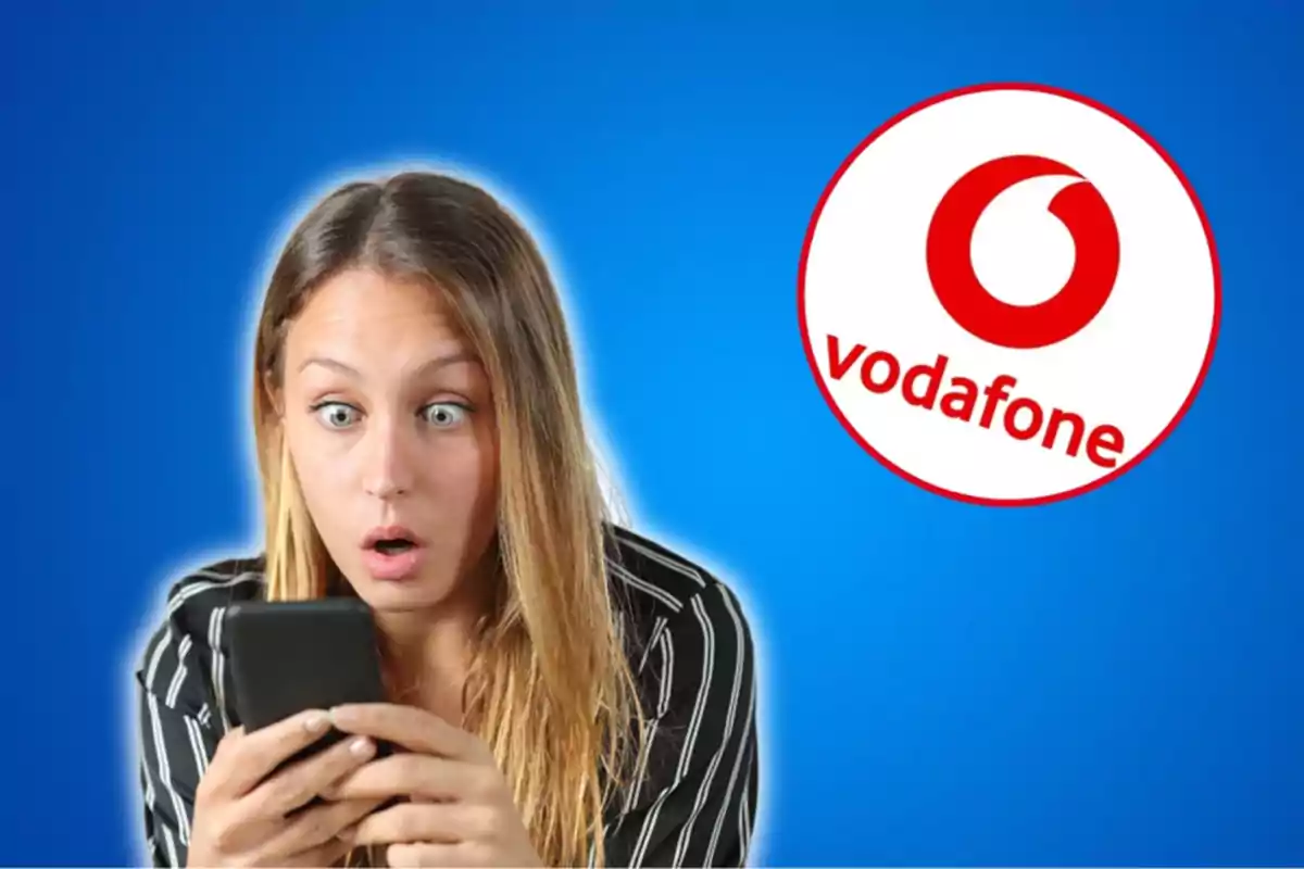 Mujer sorprendida mirando su teléfono con el logo de Vodafone en el fondo.