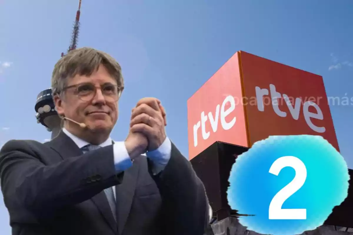 Un hombre con gafas y micrófono en la oreja aparece frente a un fondo que muestra una torre de telecomunicaciones y un cartel de RTVE con un número 2 en un círculo azul.