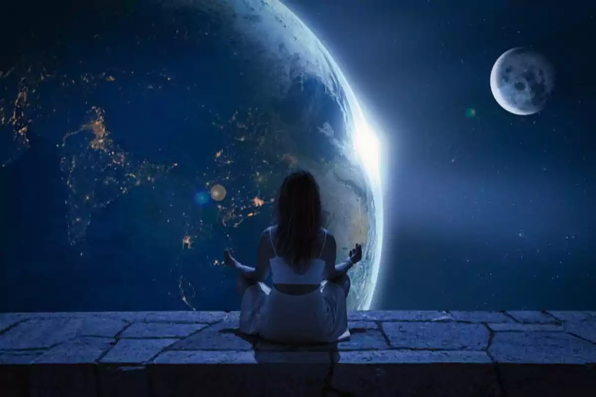 Una persona meditando frente a la Tierra y la Luna en el espacio.